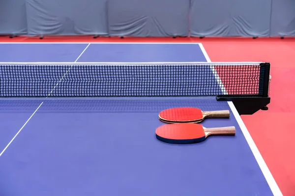 Two Pingpong Table Tennis Rackets Playing Laid Next Net Blue Stockfoto