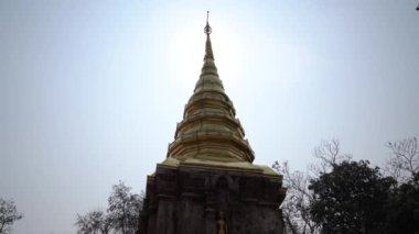 Wat Phra That Chom Kitti is its crooked chedi, contains a fragment of the Buddha relic that was split divided amongst this site, Chiang Rai, Thailand.