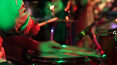 close up Professional drum player's hand plays electronic Drum with dynamic power in night club event.