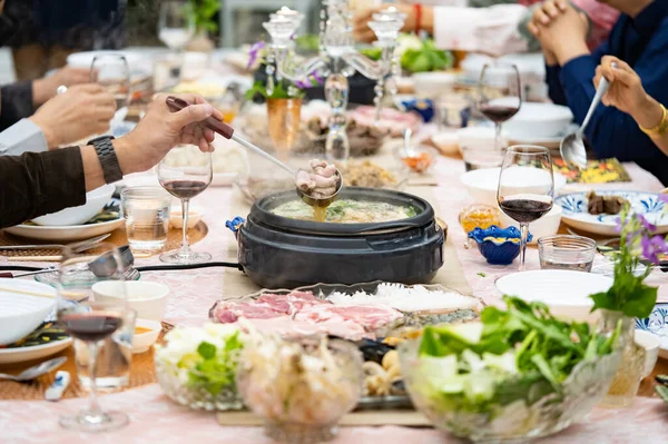 Sukiyaki Premium and Luxury Dinner Set for Celebration with special VIP guests. They have the raw material, beef, pork, chicken, egg, tofu, vegetable, shrimp, shell, squid.