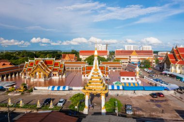 High angle view of Phra That Choeng Chum at Sakon Nakhon Province from the drone view with beautiful blue sky.