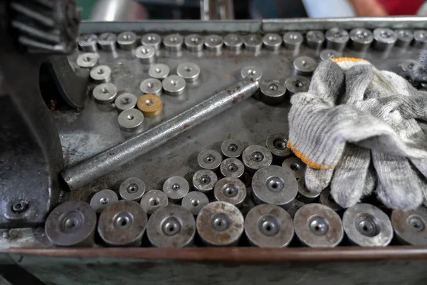 Machine and tool of Computer numerical control CNC, factory creates metal religion art such as Gold rolling machine and little jewelry in religious ceremony.