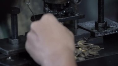 Machine and tool of Computer numerical control CNC, factory creates metal religion art such as Gold rolling machine and little jewelry in religious ceremony.