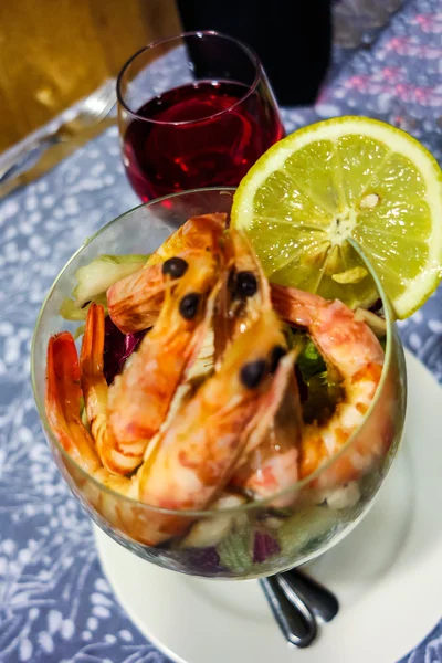 Shrimp cocktail and a glass of wine — Stock Photo, Image