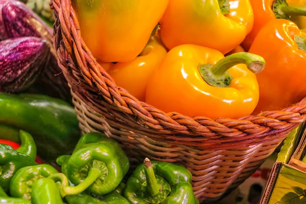 Orange peppers in basket — Stock Photo, Image