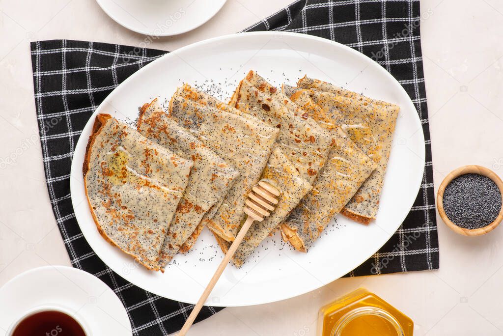 Thin crepes with poppy seeds.