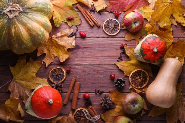 Autumn nature background border with food, flora and fauna on wooden background. Top view. Harvest festival, Thanksgiving and Halloween