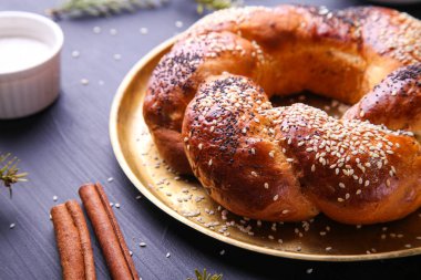 Russian national bread Kalach on a dark background