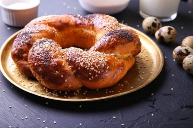 Russian national bread Kalach on a dark background