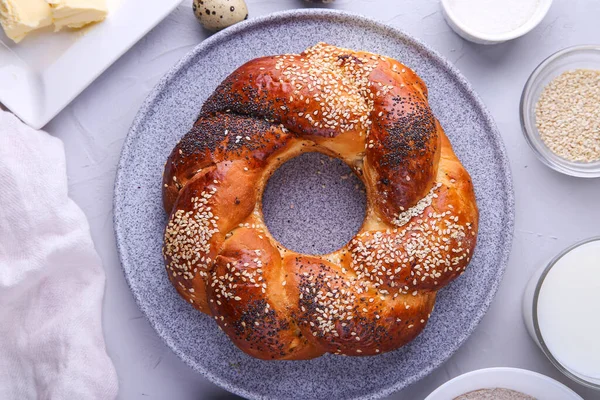 Russian national bread Kalach on a gray background.