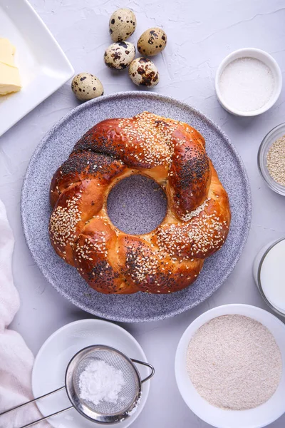Russian national bread Kalach on a gray background.