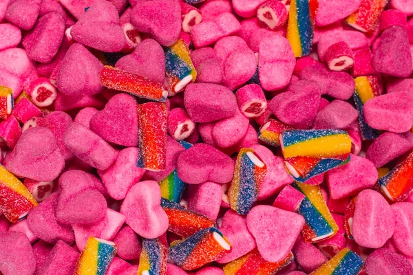 Różne Smakowite Gumowe Cukierki Widok Góry Różowy Galaretki Słodycze Tło — Zdjęcie stockowe