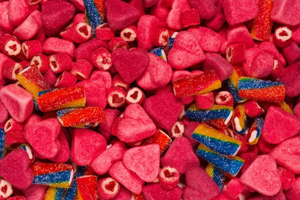 对美味的糖果进行分类 顶部视图 粉红果冻糖果背景 — 图库照片
