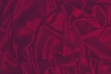 Zengin ve lüks kırmızı ipek kumaş dokusu. Üst görünüm.