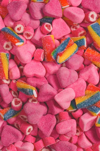 Geassorteerde Smakelijke Gummisnoepjes Bovenaanzicht Roze Gelei Snoepjes Achtergrond — Stockfoto