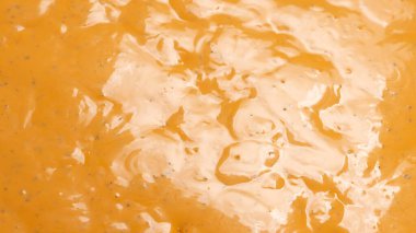 Çırpılmış leziz sos dokusu. Hamburger sosu geçmişi. Üst görünüm. 