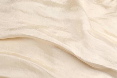 Yumuşak bej ipek kumaş arka plan. Kumaş dokusu. 