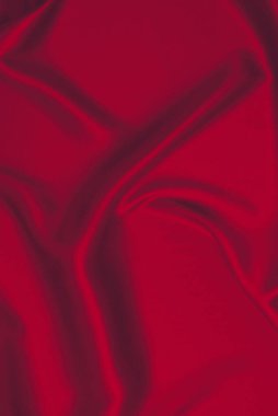 Kırmızı ipek ya da saten lüks kumaş dokusu soyut bir arka plan olarak kullanılabilir. Üst görünüm