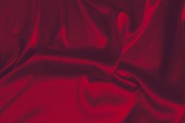 Kırmızı ipek ya da saten lüks kumaş dokusu soyut bir arka plan olarak kullanılabilir. Üst görünüm.