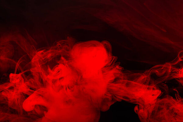 Red steam on a black background. Copy space.