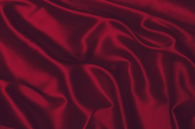 Zengin ve lüks kırmızı ipek kumaş dokusu. Üst görünüm.
