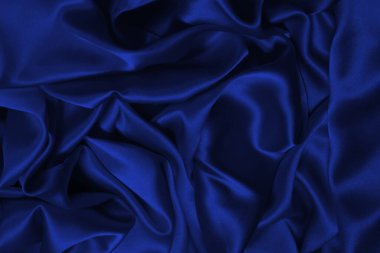 Zengin ve lüks kırmızı ipek kumaş dokusu. Üst görünüm.