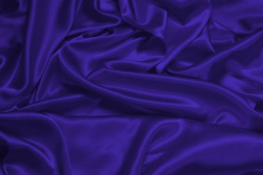 Mor ipek ya da saten lüks kumaş dokusu soyut bir arka plan olarak kullanılabilir. Üst görünüm