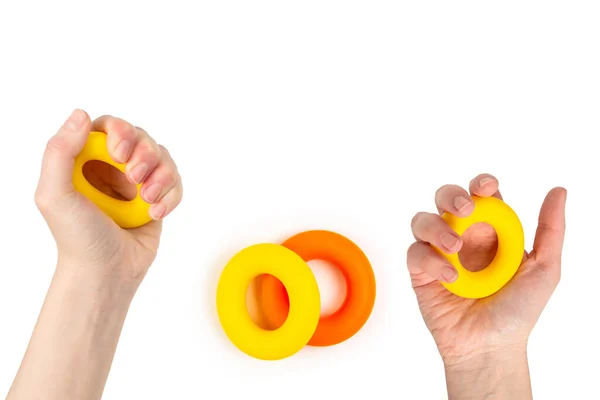 女性の手に黄色とオレンジの拡大白の背景に隔離された トップ表示 — ストック写真
