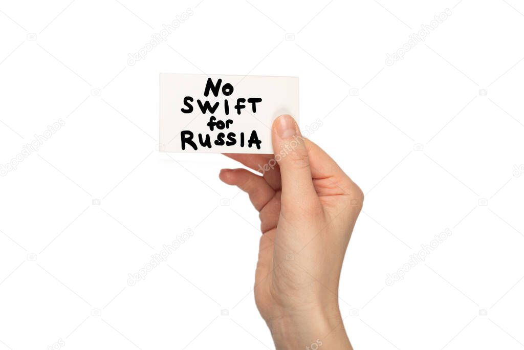 No SWIFT for Russia text on a card isolated on a white background in woman hands.