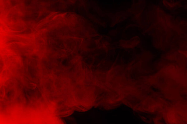 Red steam on a black background. Copy space.