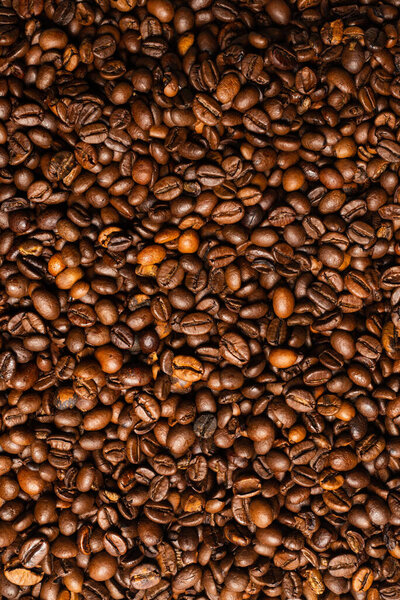 Coffee beans on a white background. Top view. Coffee beans texture.
