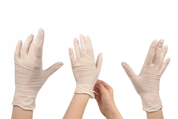 Vrouw Doet Witte Rubberen Handschoenen Aan Geïsoleerd Wit — Stockfoto