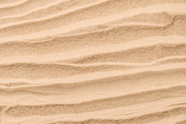 Kum dokusu yakın çekim. Kum tepesi. Üst görünüm.