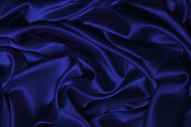 Mor ipek ya da saten lüks kumaş dokusu soyut bir arka plan olarak kullanılabilir. Üst görünüm