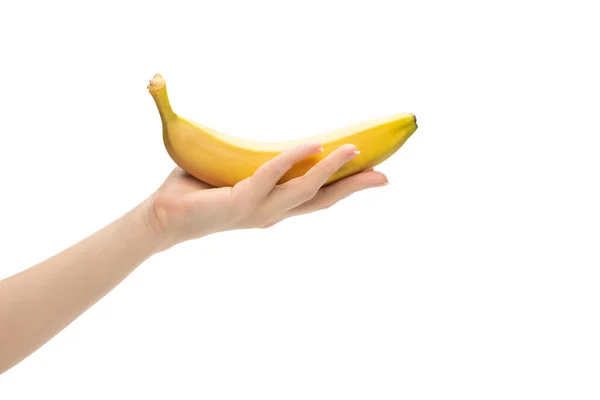 白い背景に隔離された女性の手にバナナの束 — ストック写真