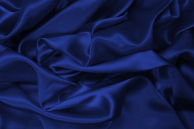 Mor ipek ya da saten lüks kumaş dokusu soyut bir arka plan olarak kullanılabilir. Üst görünüm