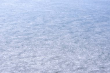 Buzun doğal dokusu, arka plan olarak donmuş göl..