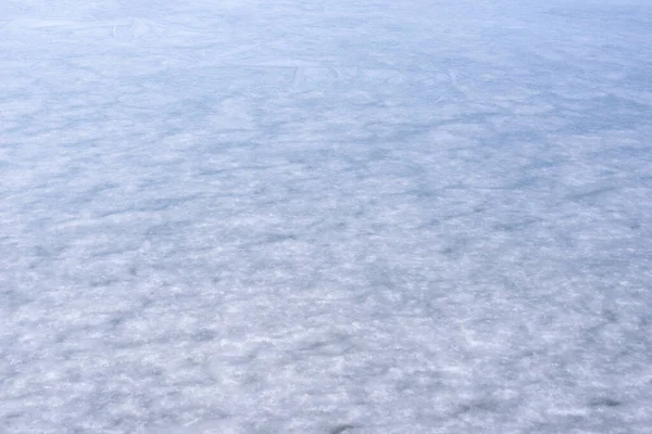 Buzun doğal dokusu, arka plan olarak donmuş göl..