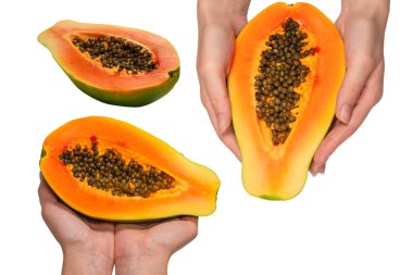 Papaya meyvesi beyaz arka planda izole bir şekilde kadınların elinde. Tropik meyve. Yarım papaya.. 