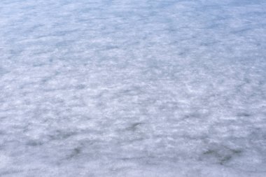 Buzun doğal dokusu, arka plan olarak donmuş göl..