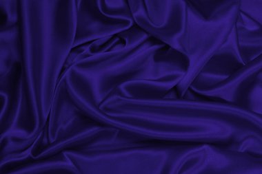 Mor ipek ya da saten lüks kumaş dokusu soyut bir arka plan olarak kullanılabilir. Üst görünüm