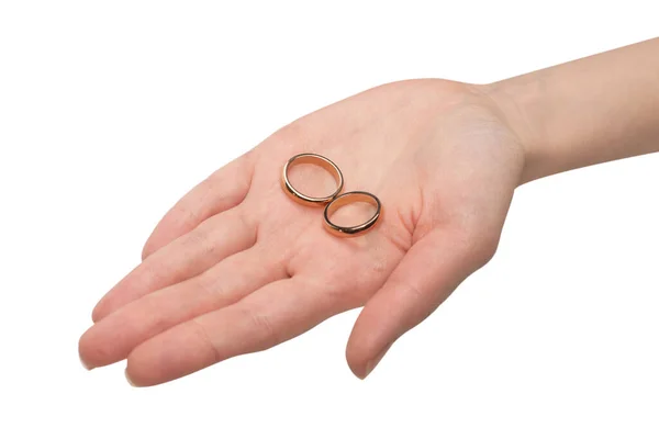 Два Золотых Кольца Руке Женщины Изолированы Белом Фоне Концепция Свадьбы — стоковое фото