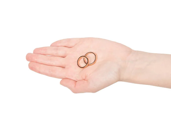 Δύο Χρυσά Δαχτυλίδια Ένα Γυναικείο Χέρι Απομονωμένα Λευκό Φόντο Έννοια — Φωτογραφία Αρχείου