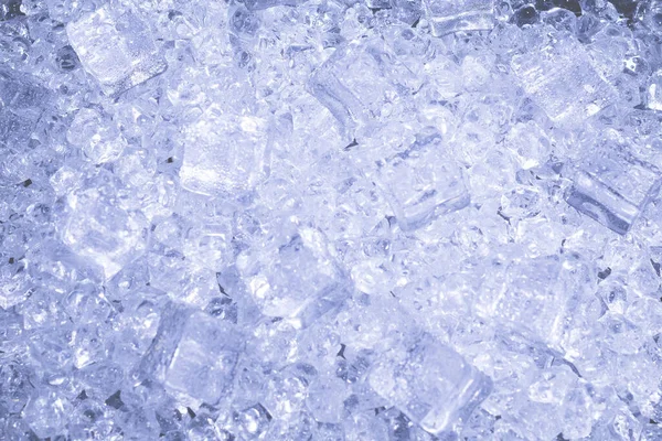 Ice crystal cubes on a black background, space for text or design.