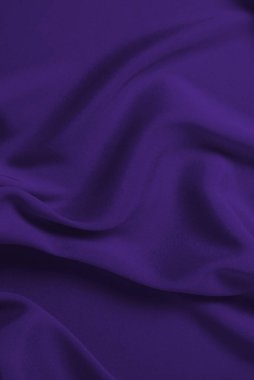 Zengin ve lüks kırmızı ipek kumaş dokusu. Üst görünüm.