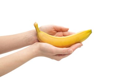 Beyaz bir arka planda, bir avuç muzu, bir kadının elinde soyutlamış..