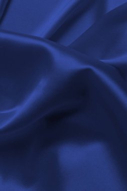 Kırmızı ipek ya da saten lüks kumaş dokusu soyut bir arka plan olarak kullanılabilir. Üst görünüm.