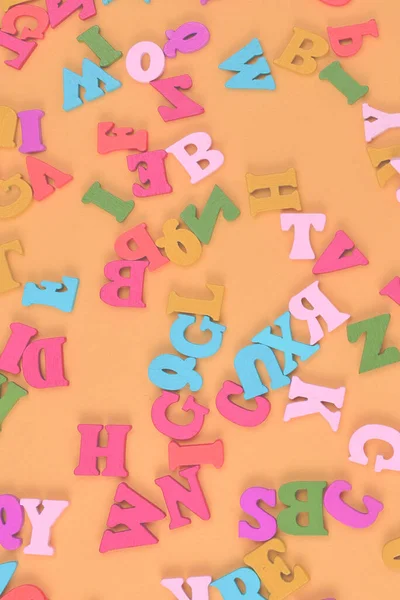 Multicolored letters on a yellow background