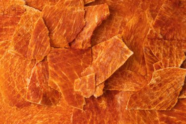 A group of tasty beer snacks. Dehydrated chicken meat slices. 