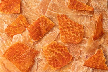 A group of tasty beer snacks. Dehydrated chicken meat slices. 